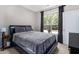Well-lit bedroom featuring a large window, black-out curtains, and a comfortable bed at 10 Perimeter Summit Ne Blvd # 4223, Brookhaven, GA 30319