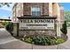 Villa Sonoma Condominiums sign with professional landscaping and stone facade at 10 Perimeter Summit Ne Blvd # 4223, Brookhaven, GA 30319