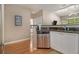 Kitchen with stainless steel dishwasher, sink, and wood flooring at 10 Perimeter Summit Ne Blvd # 4223, Brookhaven, GA 30319