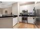 Well-lit kitchen features stainless steel appliances and breakfast bar at 10 Perimeter Summit Ne Blvd # 4223, Brookhaven, GA 30319