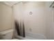 Bathroom showcasing a standard bathtub with white tile surround and neutral shower curtain at 1150 Collier Nw Rd # 10L, Atlanta, GA 30318