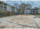 Community volleyball court with net in place surrounded by mature landscaping at 1150 Collier Nw Rd # 10L, Atlanta, GA 30318