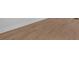 Close up of flooring. Light brown laminate flooring with white trim at 1222 E Forrest Ave, Atlanta, GA 30344