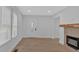 Inviting living area with a decorative fireplace and stylish, modern flooring at 1222 E Forrest Ave, Atlanta, GA 30344