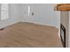 Cozy living space showcasing a fireplace and new light-colored, modern floors at 1222 E Forrest Ave, Atlanta, GA 30344