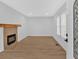 Bright living room featuring a modern fireplace and beautiful hardwood floors at 1222 E Forrest Ave, Atlanta, GA 30344