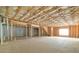 Open unfinished basement ready for customization with visible studs and concrete floor at 238 Balsam Dr, Canton, GA 30114