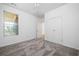 Upstairs bedroom features neutral carpet, large windows, and a closet at 238 Balsam Dr, Canton, GA 30114