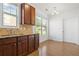 Eat-in kitchen with breakfast nook, hardwood floors, and natural light from large windows at 238 Balsam Dr, Canton, GA 30114