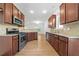 Modern kitchen with stainless steel appliances, dark cabinets, and hardwood floors, providing both style and functionality at 238 Balsam Dr, Canton, GA 30114
