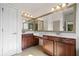 Main bathroom featuring double vanity, white countertops, and a large mirror at 238 Balsam Dr, Canton, GA 30114
