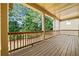 Charming covered porch with wooden decking and railings, perfect for relaxation at 238 Balsam Dr, Canton, GA 30114