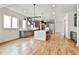 Open concept kitchen features modern appliances, quartz countertops, and a wine fridge at 1240 Hayes Sq, Peachtree City, GA 30269