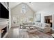 Bright living room with vaulted ceilings, a fireplace, and a neutral color palette at 1460 Lakemist Ct, Roswell, GA 30075