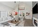Spacious living room with fireplace, hardwood flooring, and tall ceilings creates a welcoming atmosphere at 1460 Lakemist Ct, Roswell, GA 30075