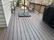 A wooden back deck featuring chairs, a grill and space for entertaining and relaxation at 2612 Peterboro Row, Marietta, GA 30062