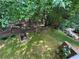 Secluded backyard features mature trees, a grassy area, and a stone walkway at 2612 Peterboro Row, Marietta, GA 30062