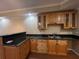 Finished basement bar area with granite counters, wooden cabinets, and a sink at 2612 Peterboro Row, Marietta, GA 30062