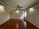 Bedroom featuring hardwood floors, neutral walls, tray ceiling, recessed lights, and a modern ceiling fan at 2612 Peterboro Row, Marietta, GA 30062