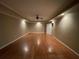 Spacious bedroom with hardwood floors, crown molding, recessed lighting, and a ceiling fan at 2612 Peterboro Row, Marietta, GA 30062