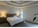 A brightly lit and spacious main bedroom with a queen-size bed, neutral walls, and a large window at 2612 Peterboro Row, Marietta, GA 30062