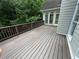 Large deck with access to sunroom provides a tranquil outdoor living space with wooded views at 2612 Peterboro Row, Marietta, GA 30062