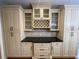 Custom kitchen cabinetry with glass-front cabinets and a dark countertop, perfect for storage and style at 2612 Peterboro Row, Marietta, GA 30062