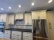 Well-equipped kitchen with stainless appliances, granite countertops, and custom cabinets with plenty of storage at 2612 Peterboro Row, Marietta, GA 30062