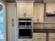 Gourmet kitchen features stainless steel appliances, custom cabinetry, and granite countertops at 2612 Peterboro Row, Marietta, GA 30062