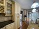 Bright eat-in kitchen features granite countertops, travertine backsplash, and stainless steel appliances at 2612 Peterboro Row, Marietta, GA 30062