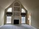 Bright and airy living room with a vaulted ceiling, fireplace, and large windows with views at 2612 Peterboro Row, Marietta, GA 30062