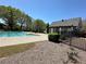 Outdoor community pool next to a covered lounge area, perfect for relaxation at 2612 Peterboro Row, Marietta, GA 30062