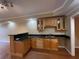 Wet bar features wooden cabinets and granite countertops at 2612 Peterboro Row, Marietta, GA 30062