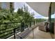 Outdoor covered balcony, with wrought iron railing and an urban view at 700 Park Regency Ne Pl # 805, Atlanta, GA 30326