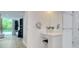 Bright bathroom featuring vanity with a makeup station, marble shower and access to large windows at 700 Park Regency Ne Pl # 805, Atlanta, GA 30326