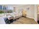 Serene bedroom with hardwood floors and access to a private balcony at 700 Park Regency Ne Pl # 805, Atlanta, GA 30326