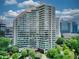 Stunning high-rise condo with curved architecture, floor-to-ceiling windows, and lush green surroundings at 700 Park Regency Ne Pl # 805, Atlanta, GA 30326