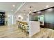 Modern kitchen featuring a large island with seating, stainless steel appliances, and stylish cabinetry, perfect for entertaining at 700 Park Regency Ne Pl # 805, Atlanta, GA 30326