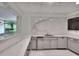 Modern kitchenette area with marble countertops and sleek cabinetry at 700 Park Regency Ne Pl # 805, Atlanta, GA 30326