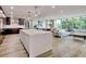 Expansive living area featuring a sleek kitchen island, cozy living space, and a dining area for versatile living at 700 Park Regency Ne Pl # 805, Atlanta, GA 30326