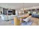 Bright, open-concept living space connects the living room, dining area, and kitchen for modern living and entertaining at 700 Park Regency Ne Pl # 805, Atlanta, GA 30326