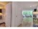 Open living room with wood floors, large windows overlooking greenery, and contemporary decor at 700 Park Regency Ne Pl # 805, Atlanta, GA 30326
