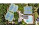 Overhead view of tennis courts, community pool and clubhouse, parking and landscaping at 10530 Tuxford Dr, Alpharetta, GA 30022