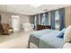 Expansive basement with a crib, dresser, and comfortable seating area, perfect for a variety of uses at 10530 Tuxford Dr, Alpharetta, GA 30022