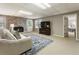 Spacious finished basement includes a comfortable seating area, a fireplace, and access to other rooms at 10530 Tuxford Dr, Alpharetta, GA 30022