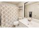 Bathroom features a shower-tub combination with a modern sink and vanity at 10530 Tuxford Dr, Alpharetta, GA 30022