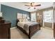 Bedroom featuring a bed, two windows, and decorations on the walls at 10530 Tuxford Dr, Alpharetta, GA 30022