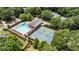 Aerial view of the community pool, clubhouse, and tennis courts, highlighting the excellent amenities at 10530 Tuxford Dr, Alpharetta, GA 30022