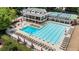 The community pool area is shown with lounge chairs, umbrellas, diving board and clubhouse at 10530 Tuxford Dr, Alpharetta, GA 30022