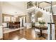 Inviting dining room with hardwood floors, elegant lighting, and wainscoting details perfect for Gathering gatherings at 10530 Tuxford Dr, Alpharetta, GA 30022